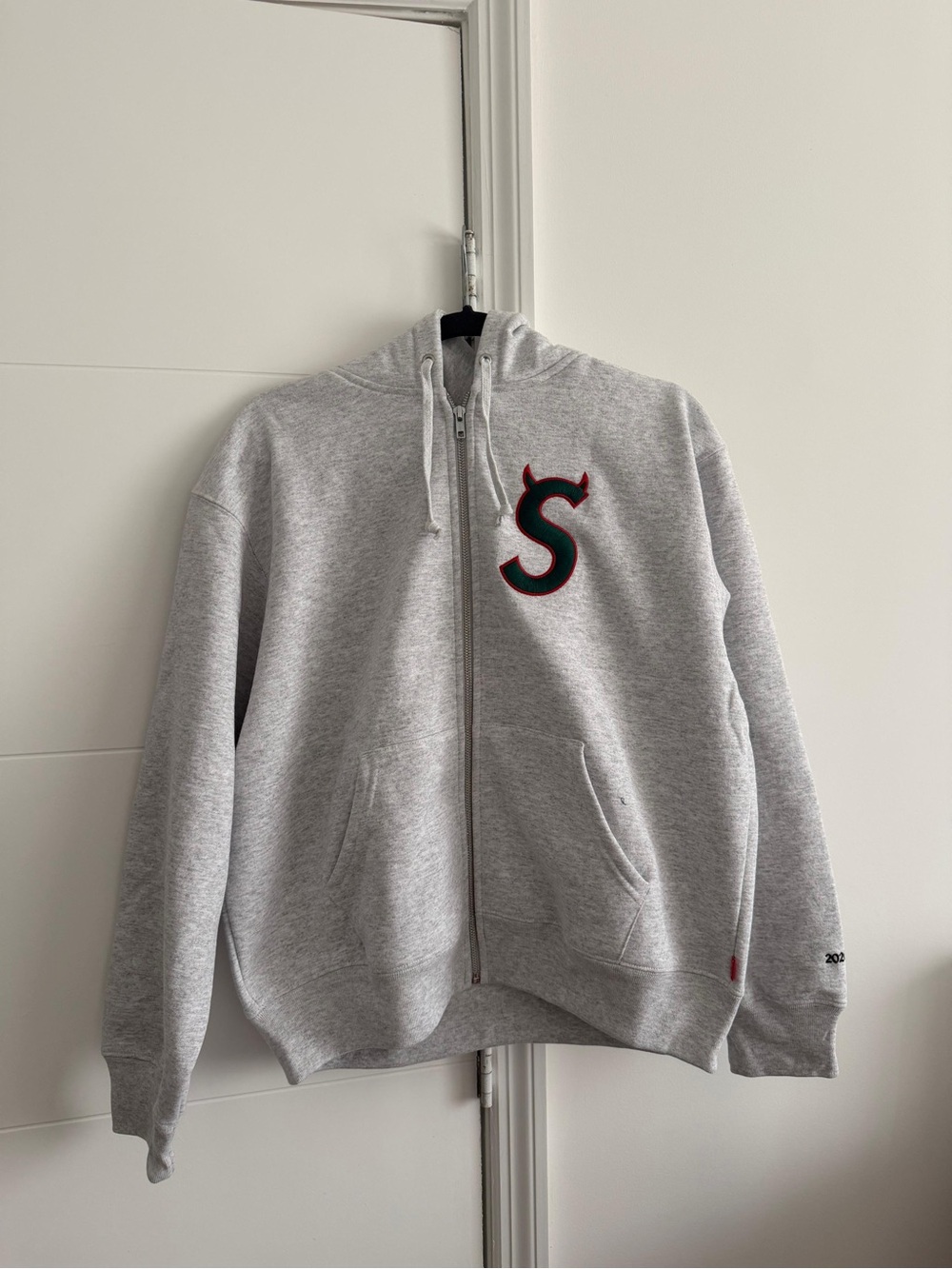 Supreme Gray Zip-Up Hoodie with Red-Trim 'S' Emblem
